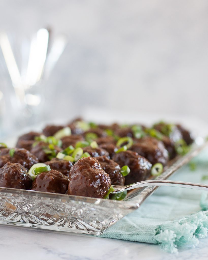 Slow cooker guava glazed meatballs is a great dish to serve at parties! This recipe is a unique spin on traditional slow cooker meatball recipes. * Recipe on GoodieGodmother.com