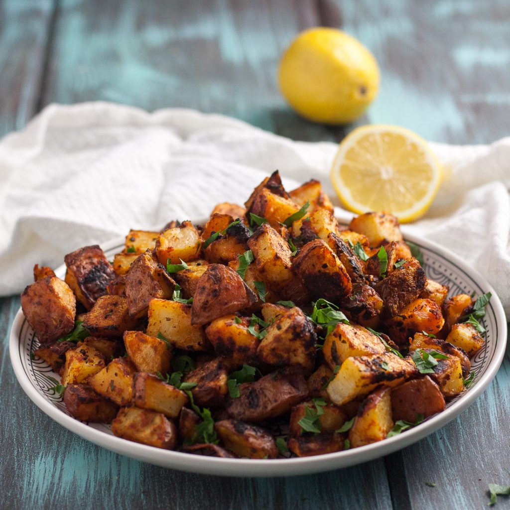 This recipe has a hint of lemon, the right amount of paprika, and an incredible crispy texture. These crispy oven roasted Spanish potatoes are delicious! * Recipe on GoodieGodmother.com
