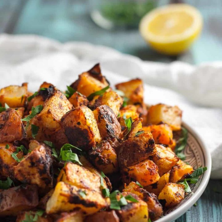 This recipe has a hint of lemon, the right amount of paprika, and an incredible crispy texture. These crispy oven roasted Spanish potatoes are delicious! * Recipe on GoodieGodmother.com