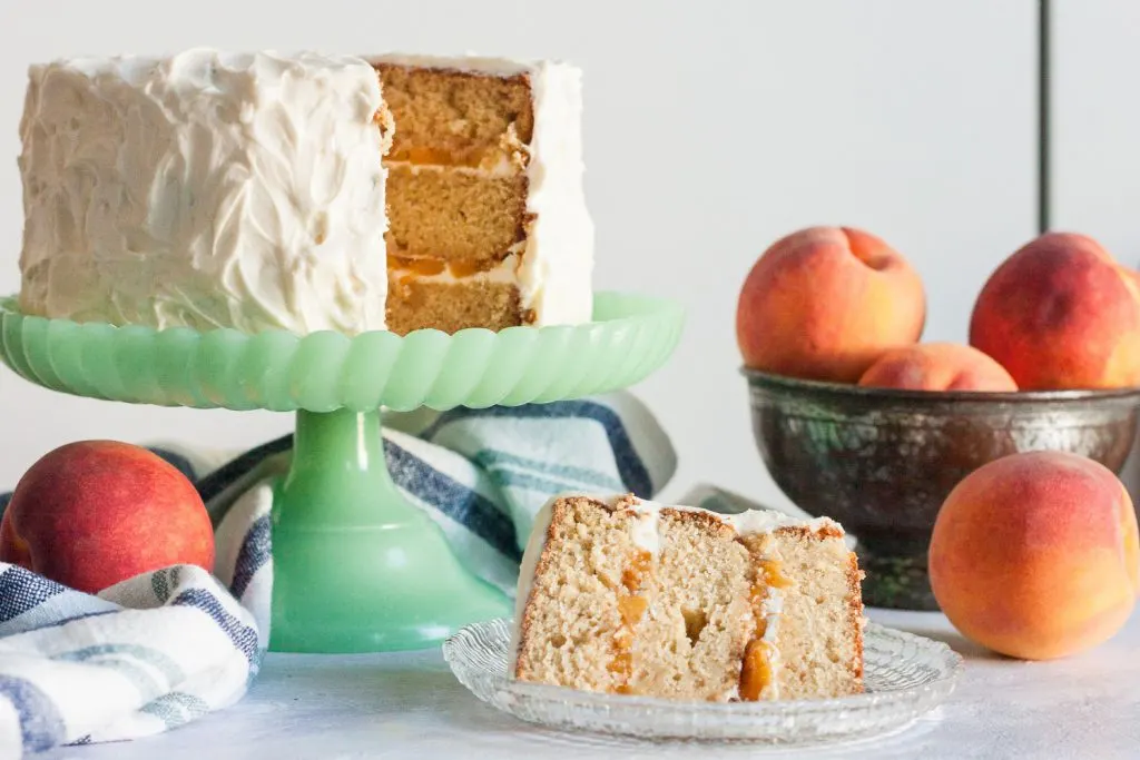 Fresh peaches, and a little peach wine, make this peach wine cake from scratch a delicious cake fit for a Southern belle!  * GoodieGodmother.com
