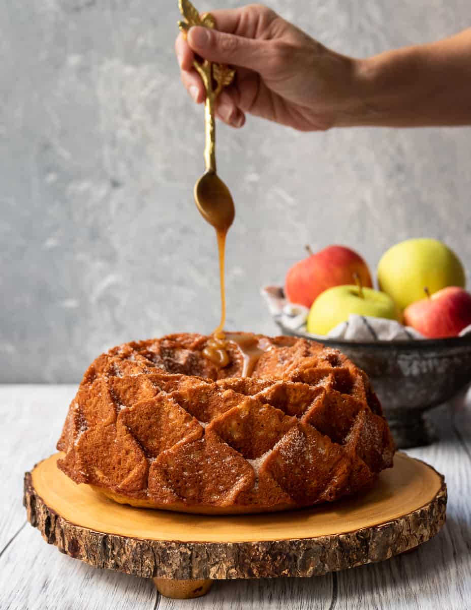 Imagine fall in a bite. This caramel apple cider bundt cake is like the cake version of apple cider doughnuts, with loads more apple flavor, and caramel. *Apple Cider Doughnut Cake Recipe on GoodieGodmother.com