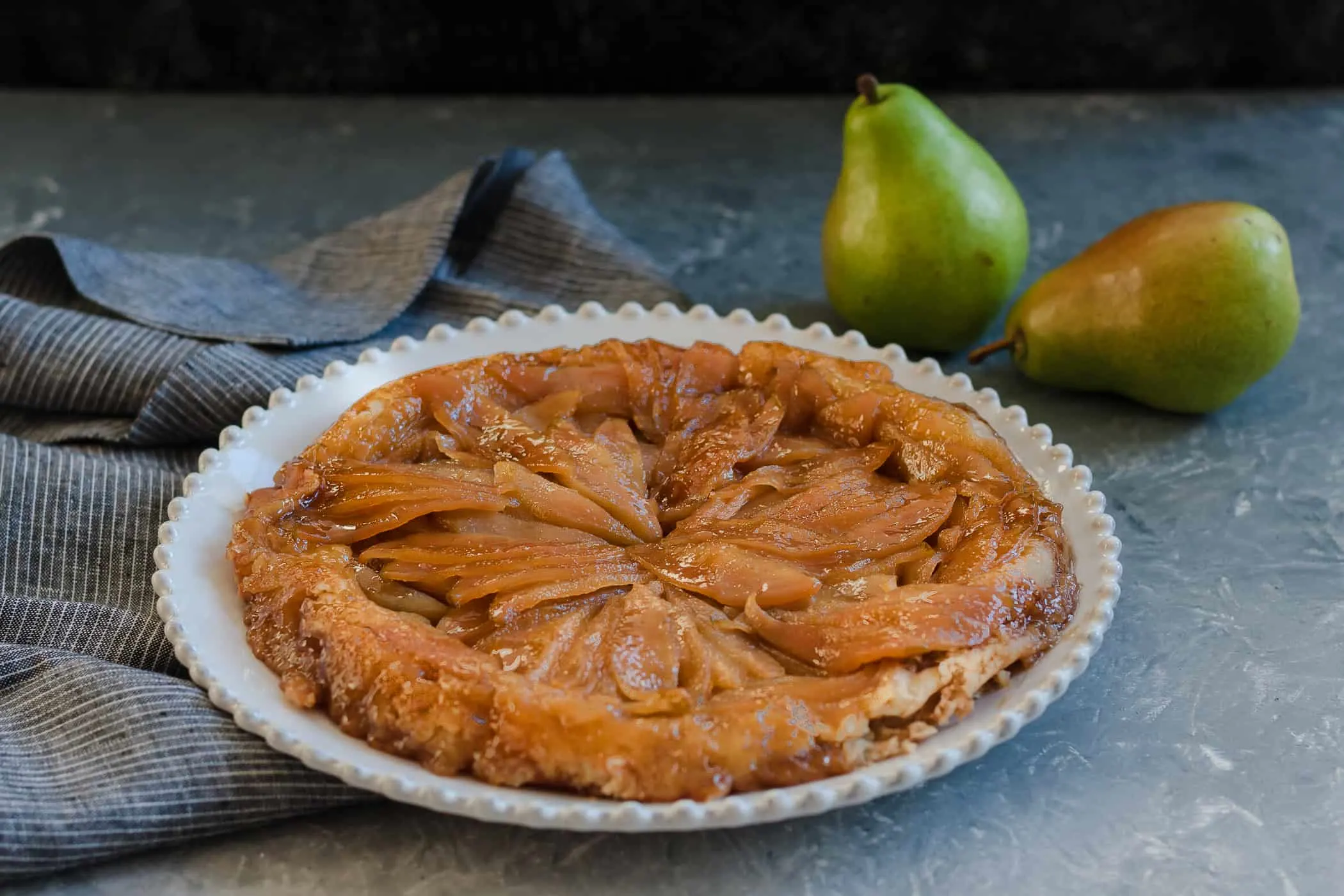A unique seasonal fall dessert, caramelized pear upside down pie is a great reason to break out the cast iron cookware! * Recipe on GoodieGodmother.com