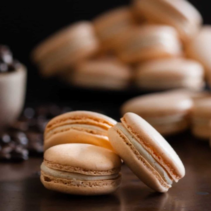 Pumpkin spice latte macarons are a fun take on a classic fall coffeehouse drink! * Recipe on GoodieGodmother.com