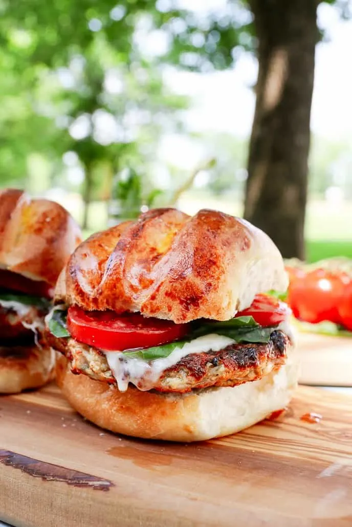 Bring your favorite Italian flavors to the grill this summer with this Italian Grilled Chicken Burgers Recipe! This is a sponsored conversation written by me on behalf of Sargento®. Recipe on GoodieGodmother.com #burgers #summer #grillingrecipes #grilledchicken #chickenrecipe #ad #goodiegodmother