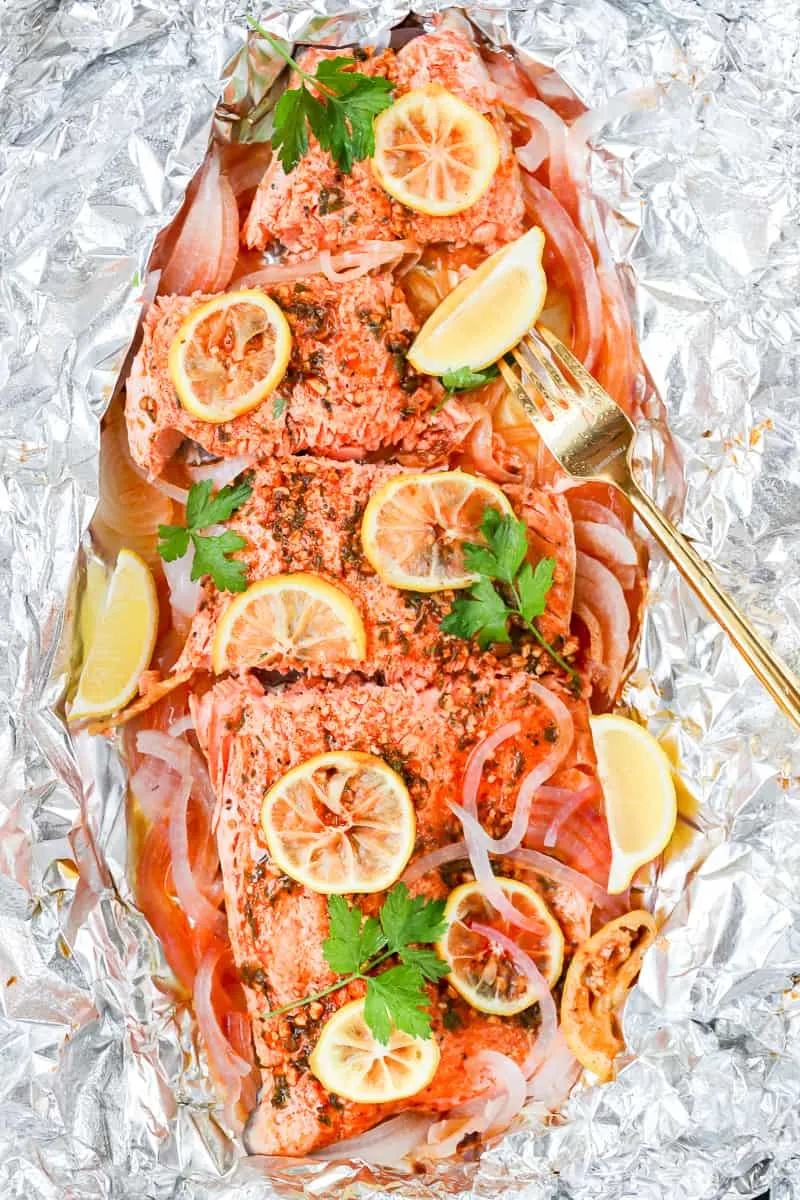 Smoked paprika herb salmon grilled in foil is a flavorful, almost effortless main dish. Season, cook, serve right in the foil. Get this foil grilled salmon recipe on GoodieGodmother.com