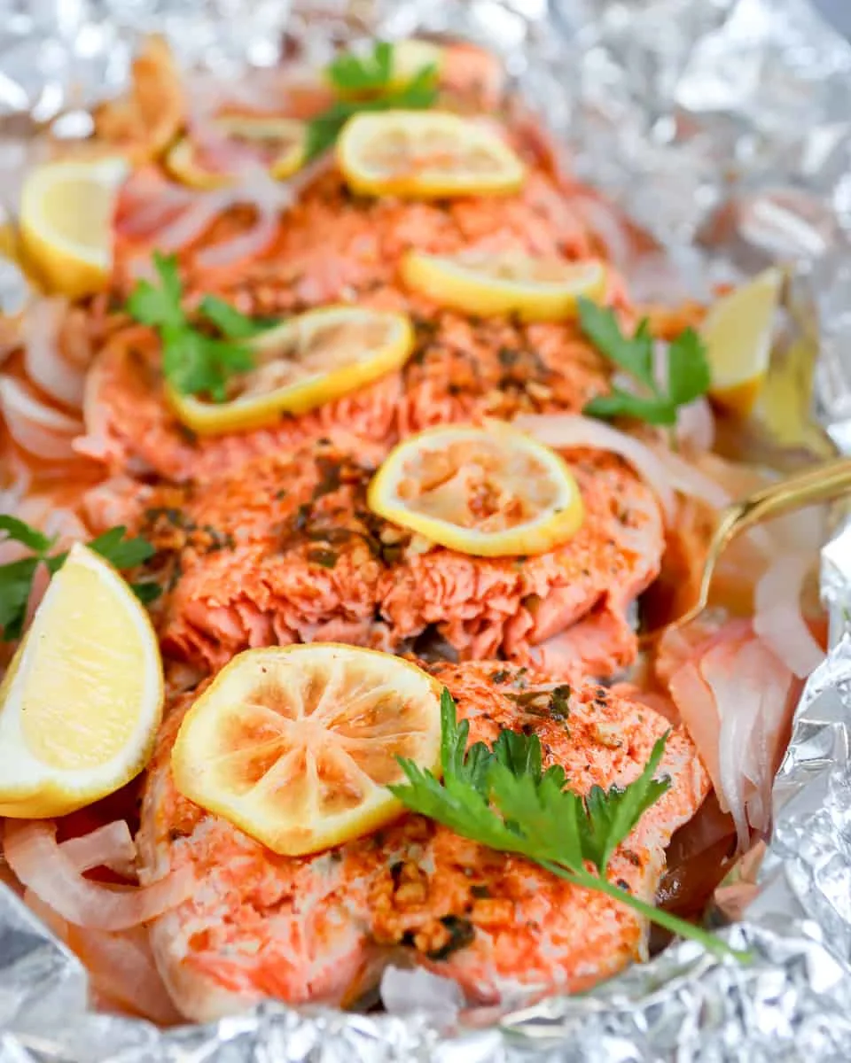 Smoked paprika herb salmon grilled in foil is a flavorful, almost effortless main dish. Season, cook, serve right in the foil. Get this foil grilled salmon recipe on GoodieGodmother.com
