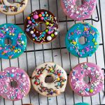 Whip up a batch of colorful iced sugar cookies in no time with this doughnut sugar cookie tutorial and easy cookie glaze recipe! It's so easy to make these colorful cookies - even if you've never decorated a sugar cookie before. * GoodieGodmother.com