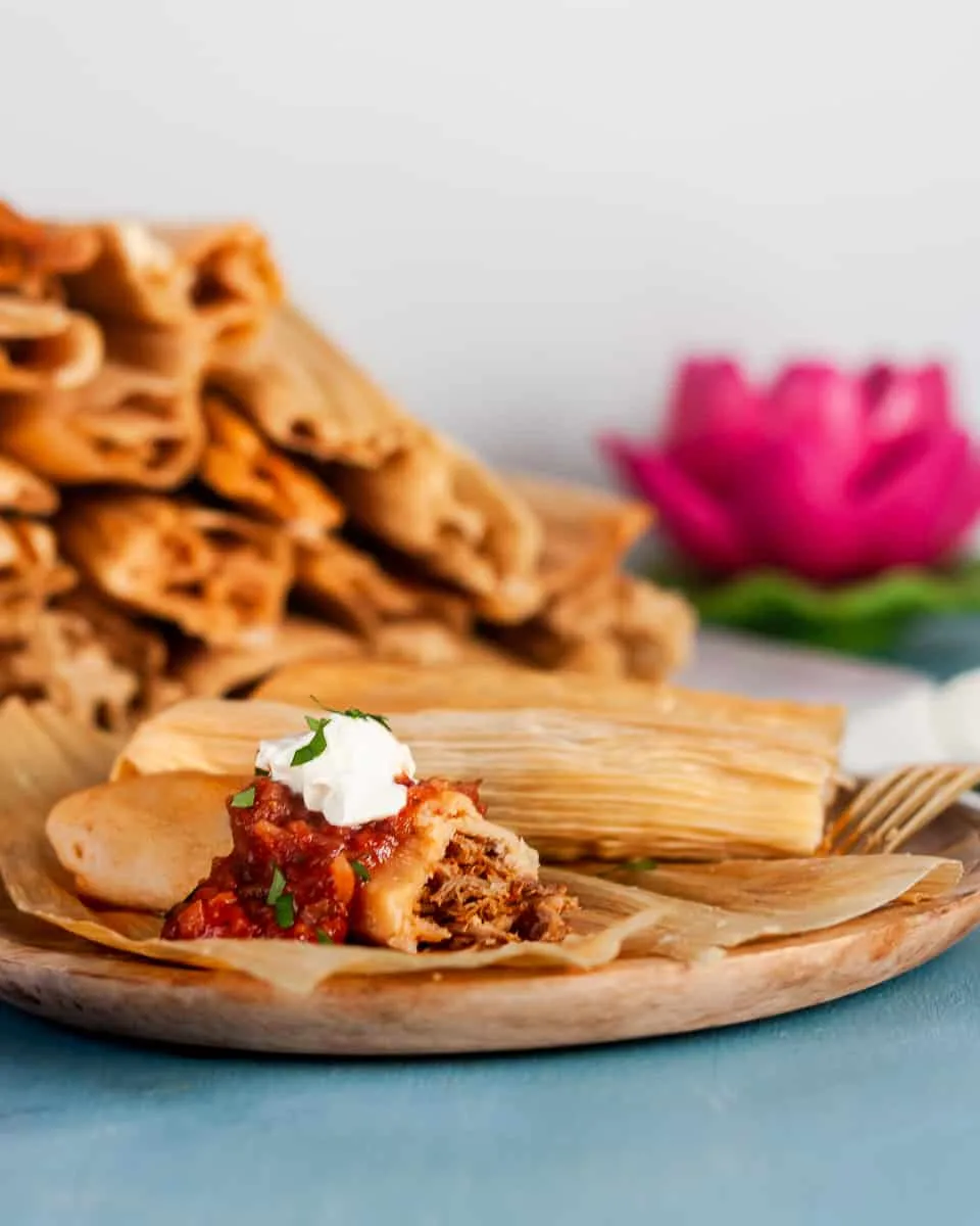 Mexican Pork Tamales are a traditional Christmas food - although they are enjoyed year round! Gather friends, host a tamalada (tamale rolling party), and enjoy! * Recipe on GoodieGodmother.com
