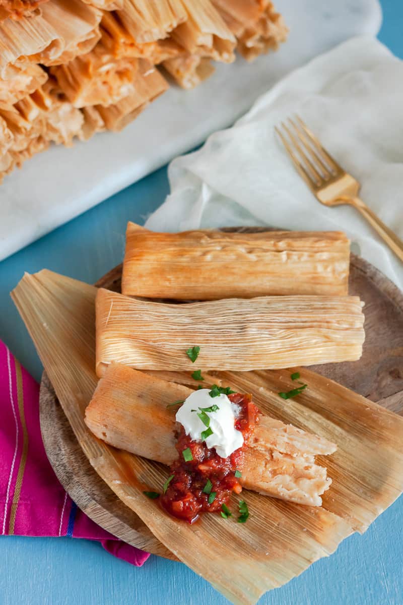Mexican Pork Tamales are a traditional Christmas food - although they are enjoyed year round! Gather friends, host a tamalada (tamale rolling party), and enjoy! * Recipe on GoodieGodmother.com