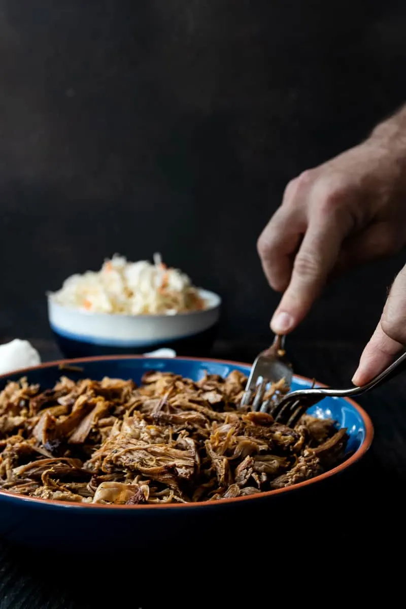 Low and slow is key for this easy slow cooker pulled pork recipe! You'll get smokehouse worthy results with this pulled pork recipe based off Georgia style pork barbecue! * Recipe on GoodieGodmother.com