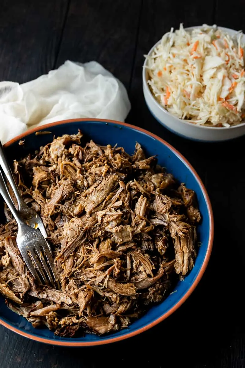 Low and slow is key for this easy slow cooker pulled pork recipe! You'll get smokehouse worthy results with this pulled pork recipe based off Georgia style pork barbecue! Try your hand at this healthy BBQ pork loin cooked in your crock pot. Plus no sauce needed! #porkloin #bbq #crockpotrecipe #pulledpork #easydinner * Recipe on GoodieGodmother.com