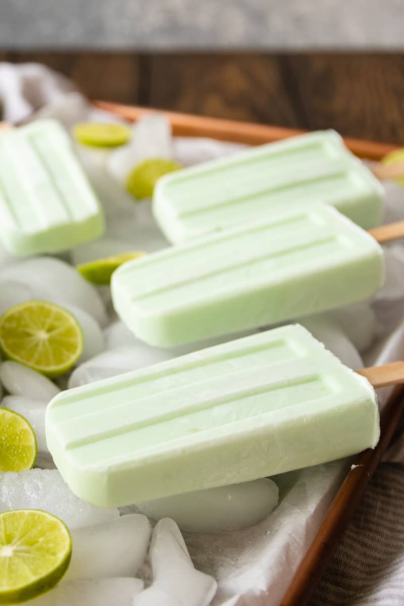 Stay cool with these gluten free key lime pie inspired lime Greek yogurt popsicles! Ready to freeze in 5 minutes, and easy enough for the kids to make.