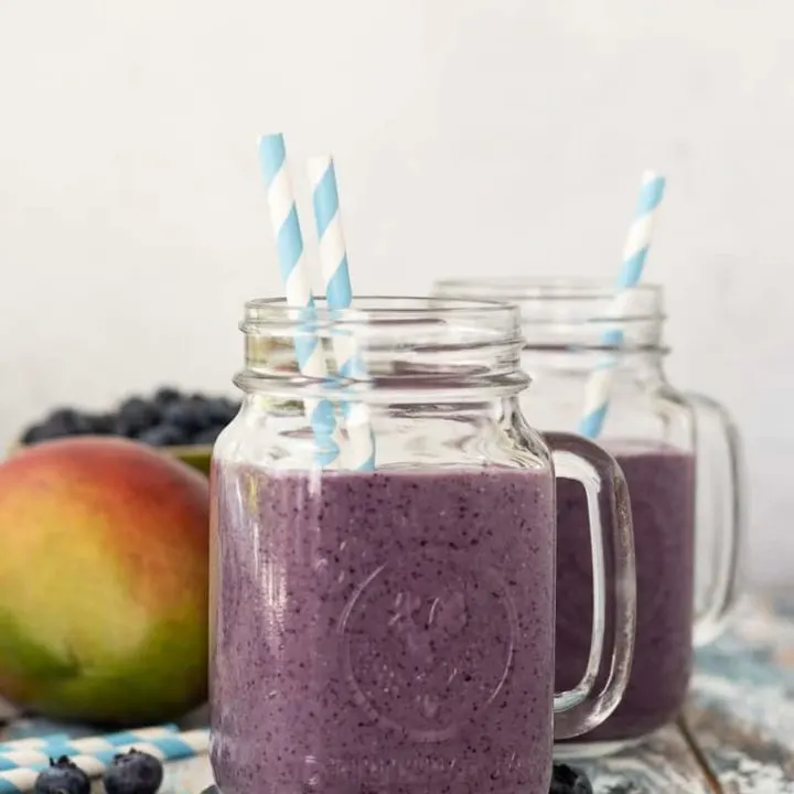 Perfect for busy mornings, this blueberry mango breakfast smoothie is a great way to start the day! * Recipe on GoodieGodmother.com #breakfastideas #easyrecipes #foodideas #easyrecipe #smoothierecipe