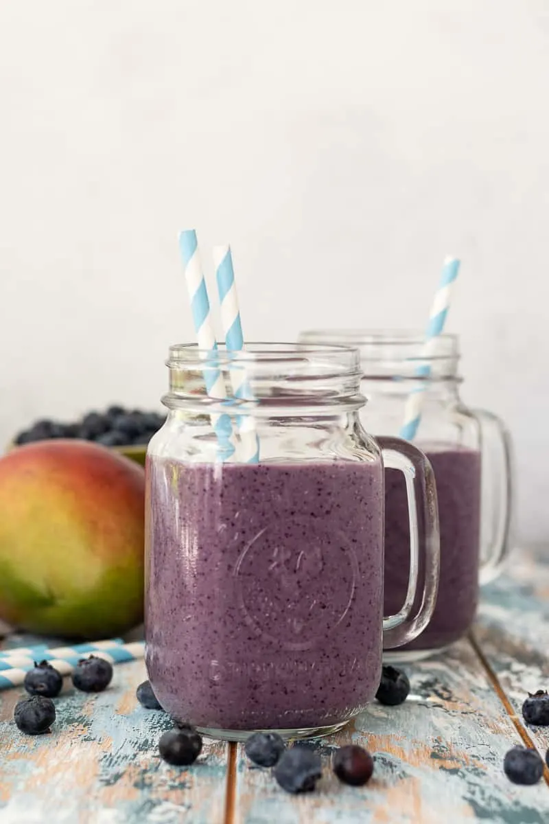 Perfect for busy mornings, this blueberry mango breakfast smoothie is a great way to start the day! * Recipe on GoodieGodmother.com #breakfastideas #easyrecipes #foodideas #easyrecipe #smoothierecipe