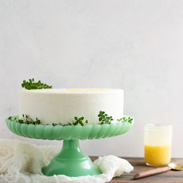 Delight citrus lovers with this triple layer lemon cake from scratch! This tender cake, filled with lemon curd and topped with vanilla icing is one of my most popular from-scratch cake recipes!