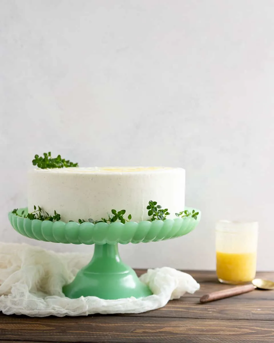 Delight citrus lovers with this triple layer lemon cake from scratch! This tender cake, filled with lemon curd and topped with vanilla icing is one of my most popular from-scratch cake recipes!