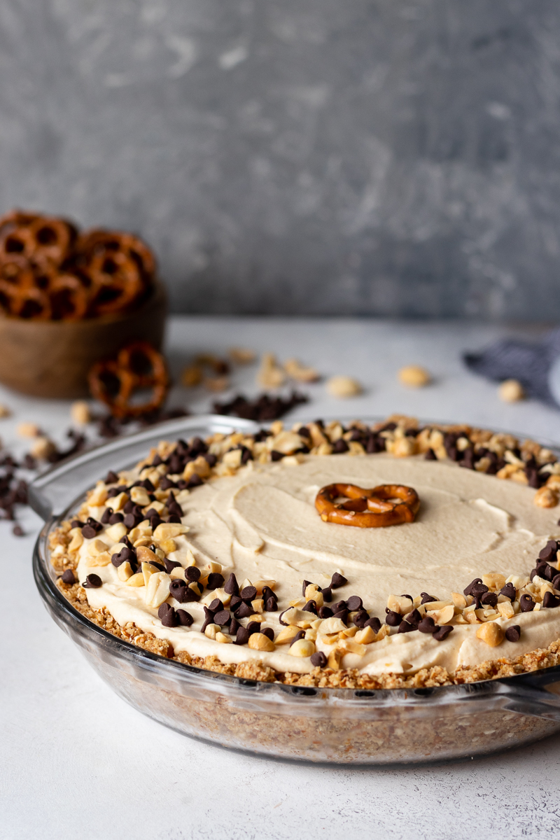 Salty and sweet, this light no bake chocolate peanut butter pretzel pie makes a great special dessert on a hot day! * Recipe on GoodieGodmother.com #nobake #easypierecipe #peanutbutter #chocolatepeanutbutter