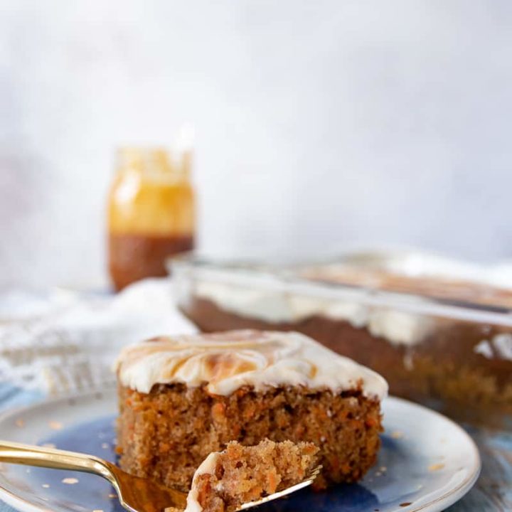 A simple carrot sheet cake with elevated flavor! This carrot spice cake with salted caramel frosting is everything you love about carrot cake without the fuss. * Recipe on GoodieGodmother.com #dessertideas #cakerecipe #carrotcake #sheetcake #easyrecipes #foodideas