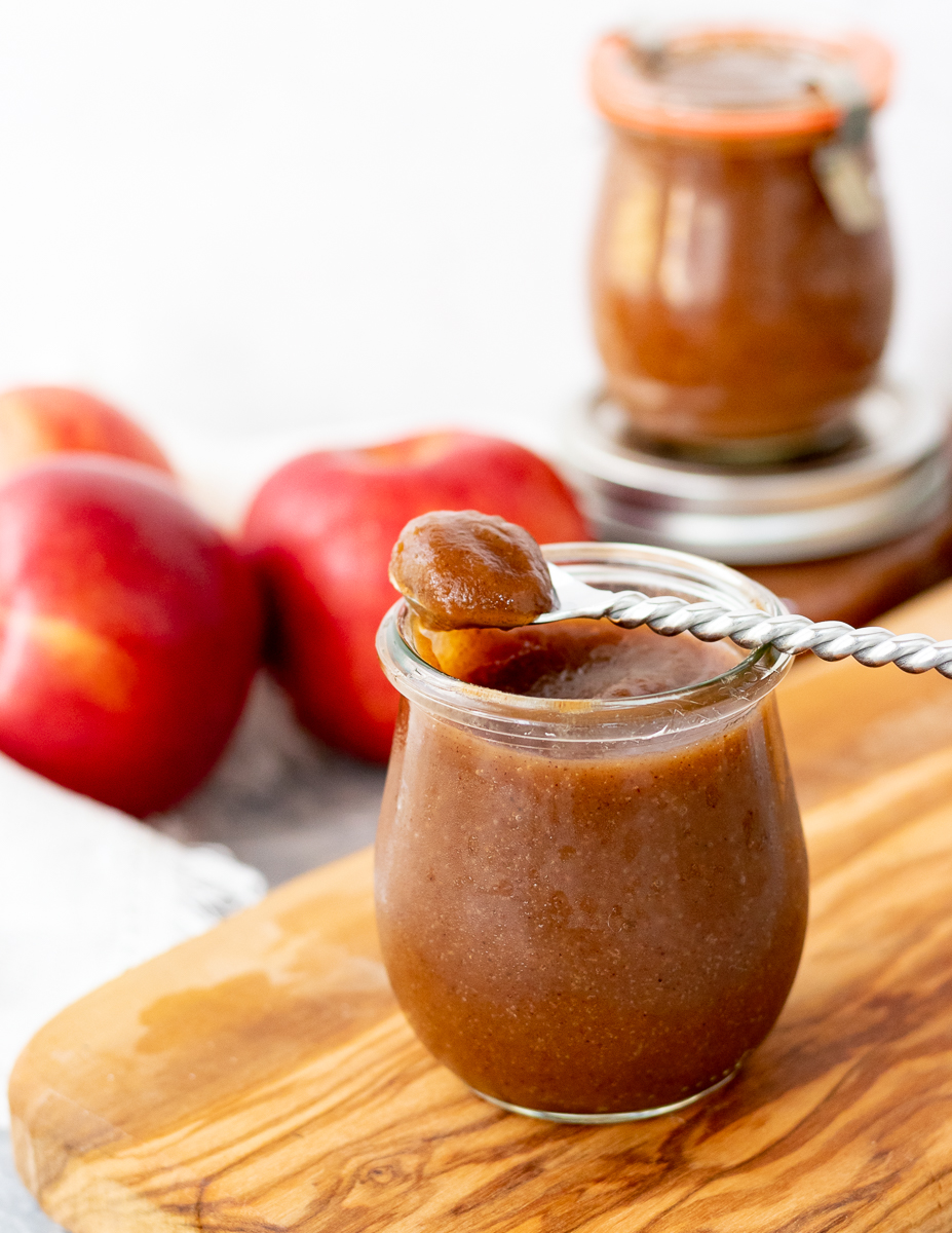 spoon resting on jar with apple butter