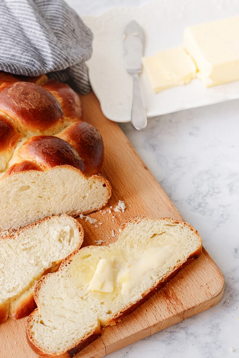 challah bread serving suggestion - shown spread with a bit of butter