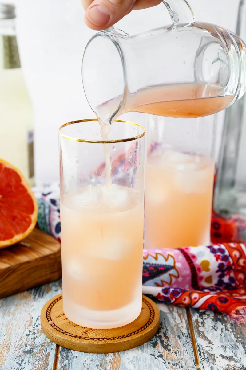 pour fresh grapefruit juice for the best paloma cocktail 