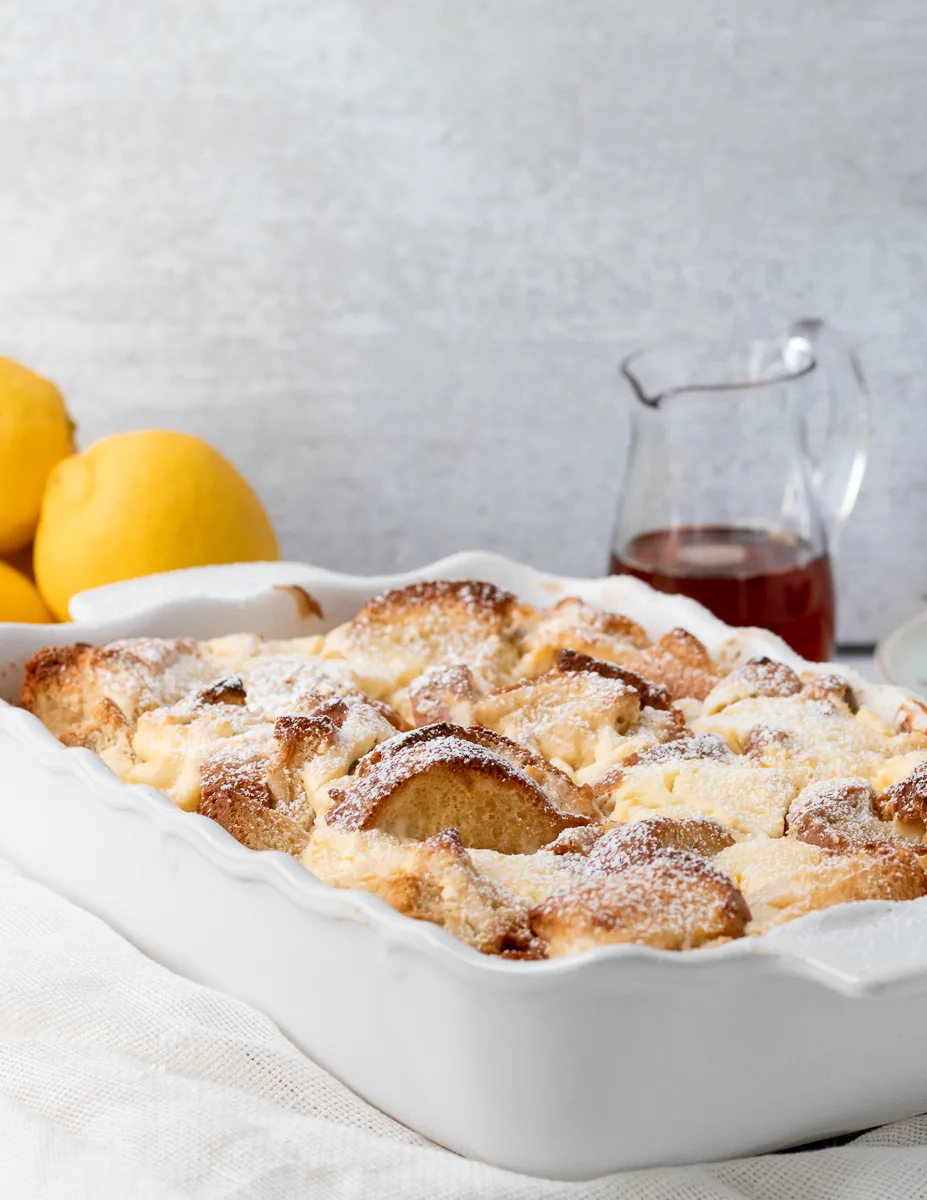 lemon cheesecake french toast casserole dusted with powdered sugar