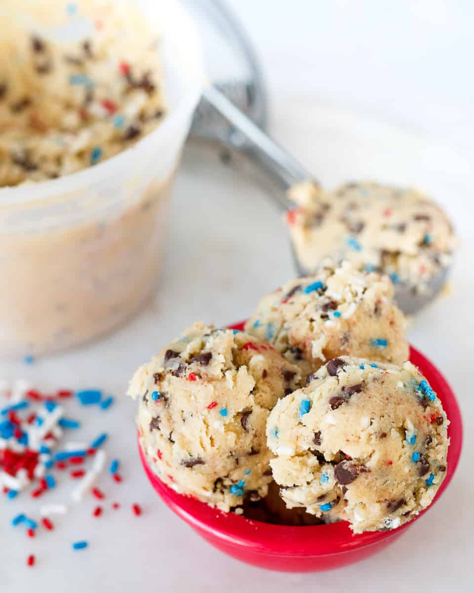 patriotic edible cookie dough mini scoops in a small red bowl