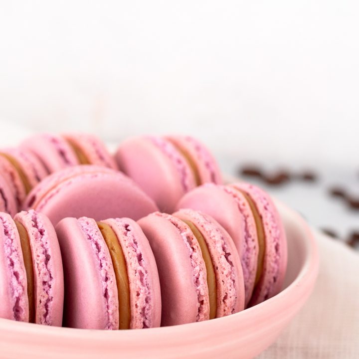 raspberry white chocolate mocha latte macarons styled on a plate for serving