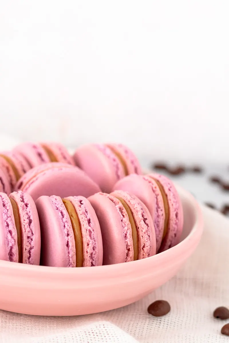 raspberry white chocolate mocha latte macarons styled on a plate for serving