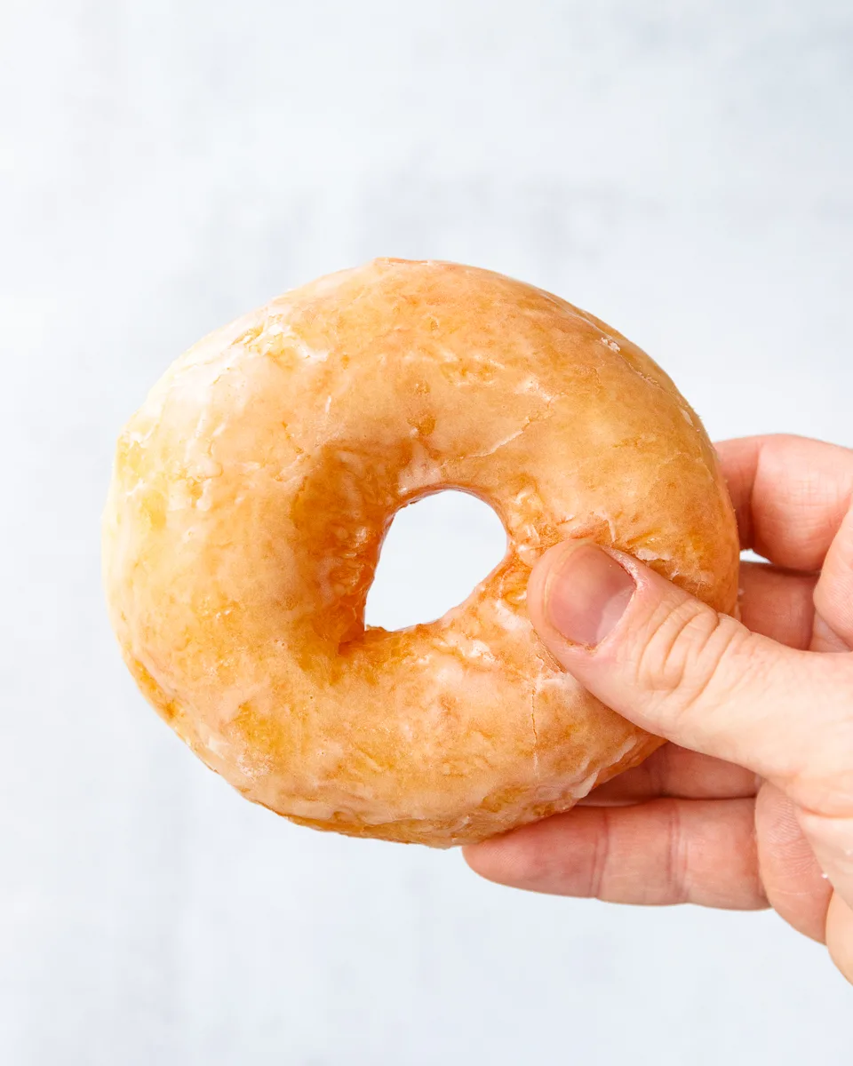 sourdough doughnut held in a hand