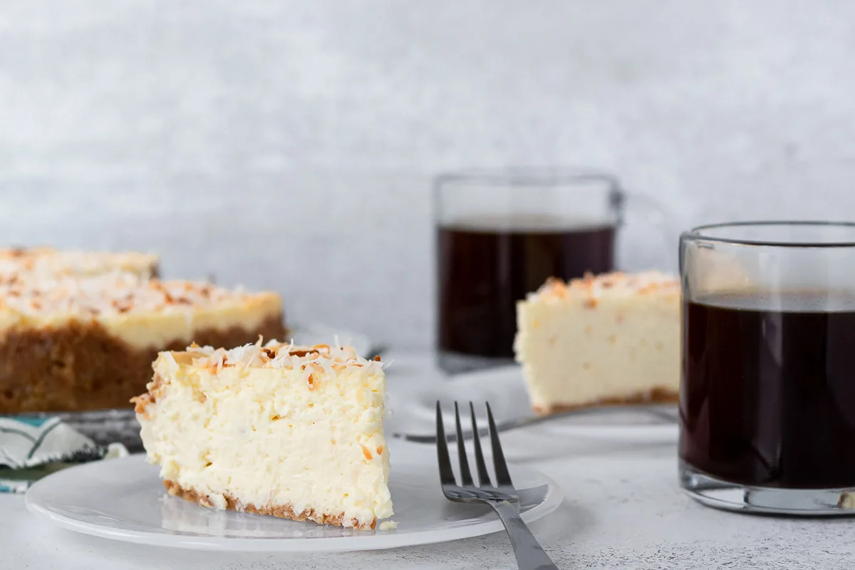 slice of coconut cheesecake on a plate to show the texture