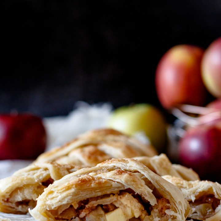 sliced puff pastry apple strudel braid sliced to show filling