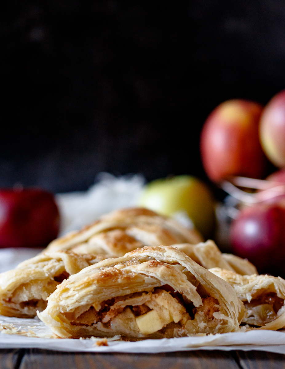 sliced puff pastry apple strudel braid sliced to show filling