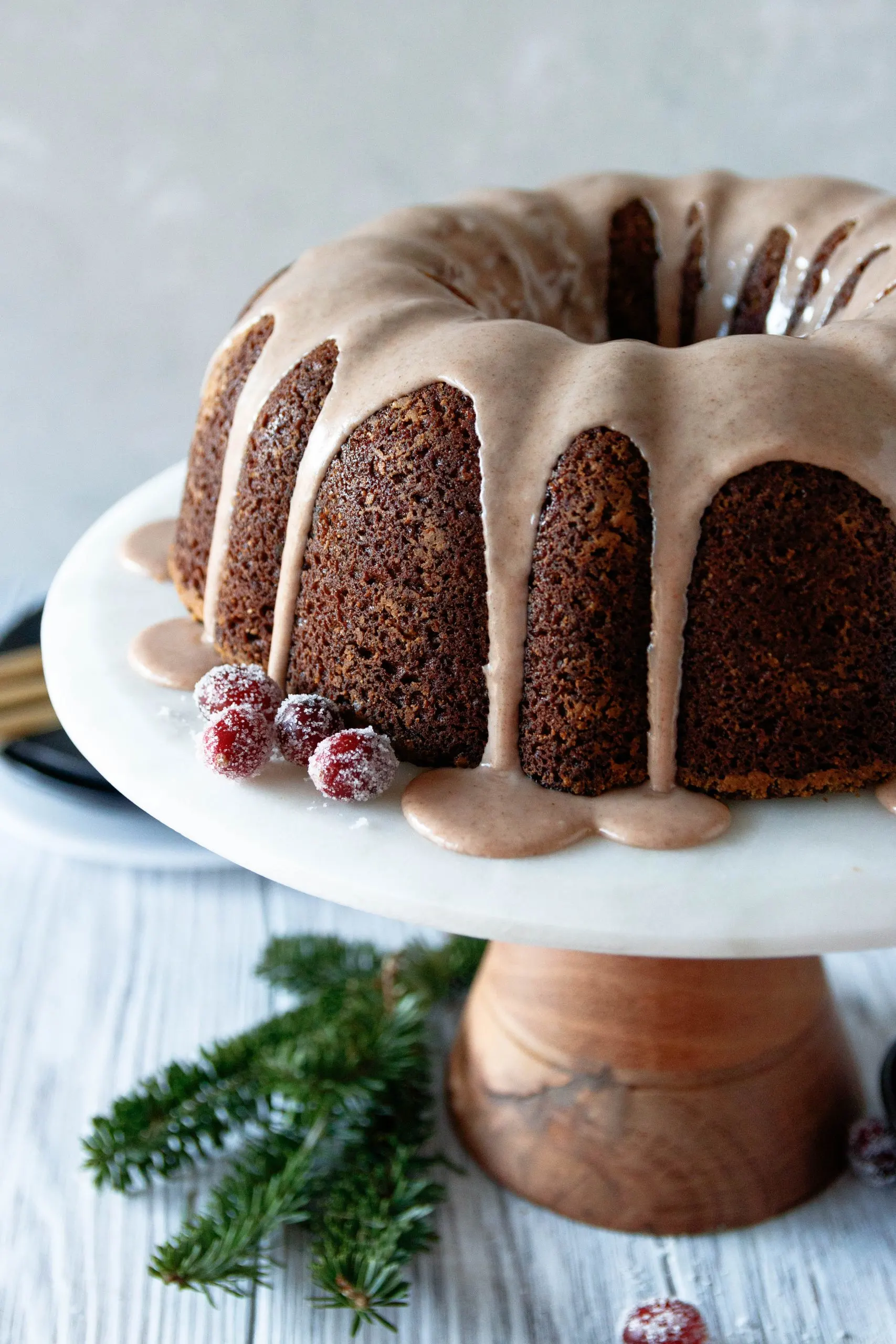 angled picture of the bundt cake to show the glaze and rich color