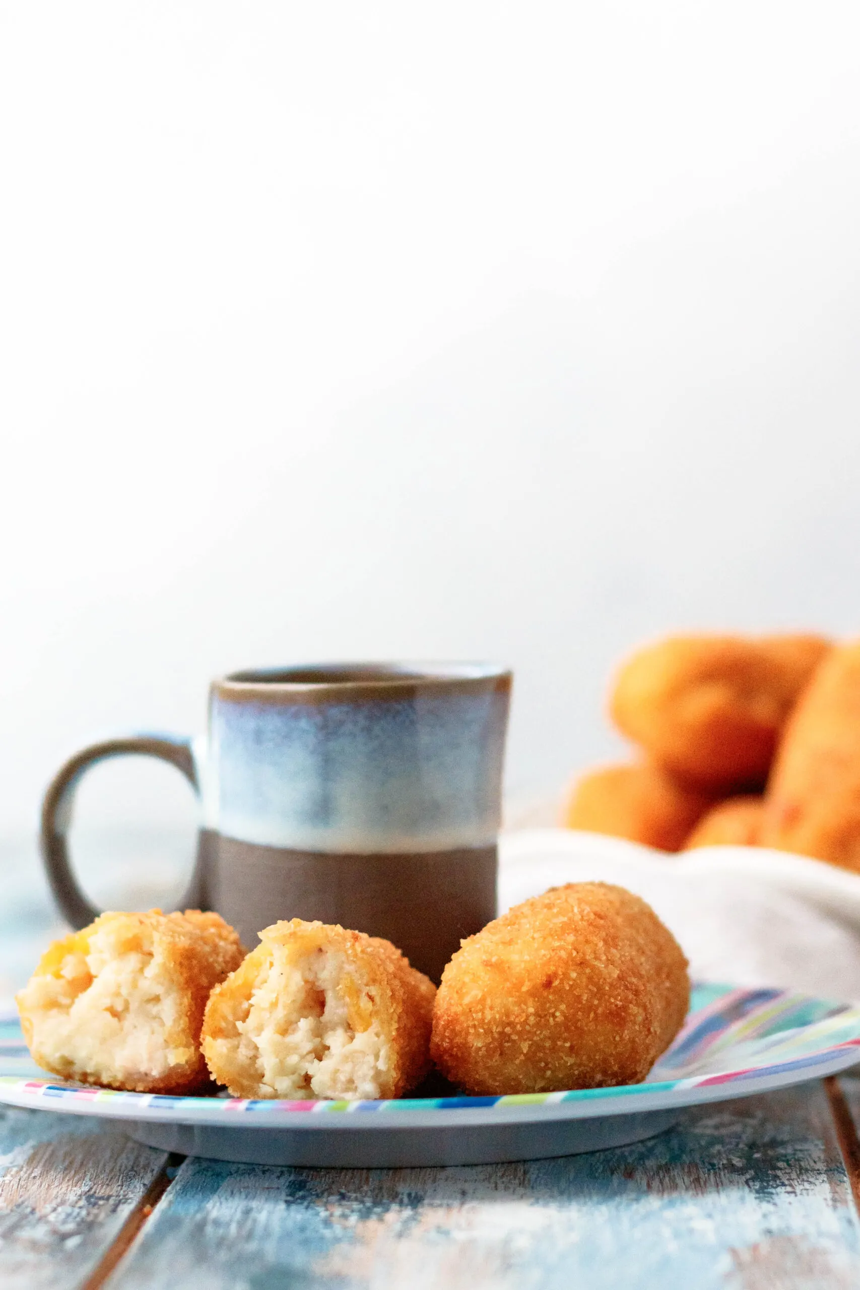 straight on view of the plated croquetas with coffee