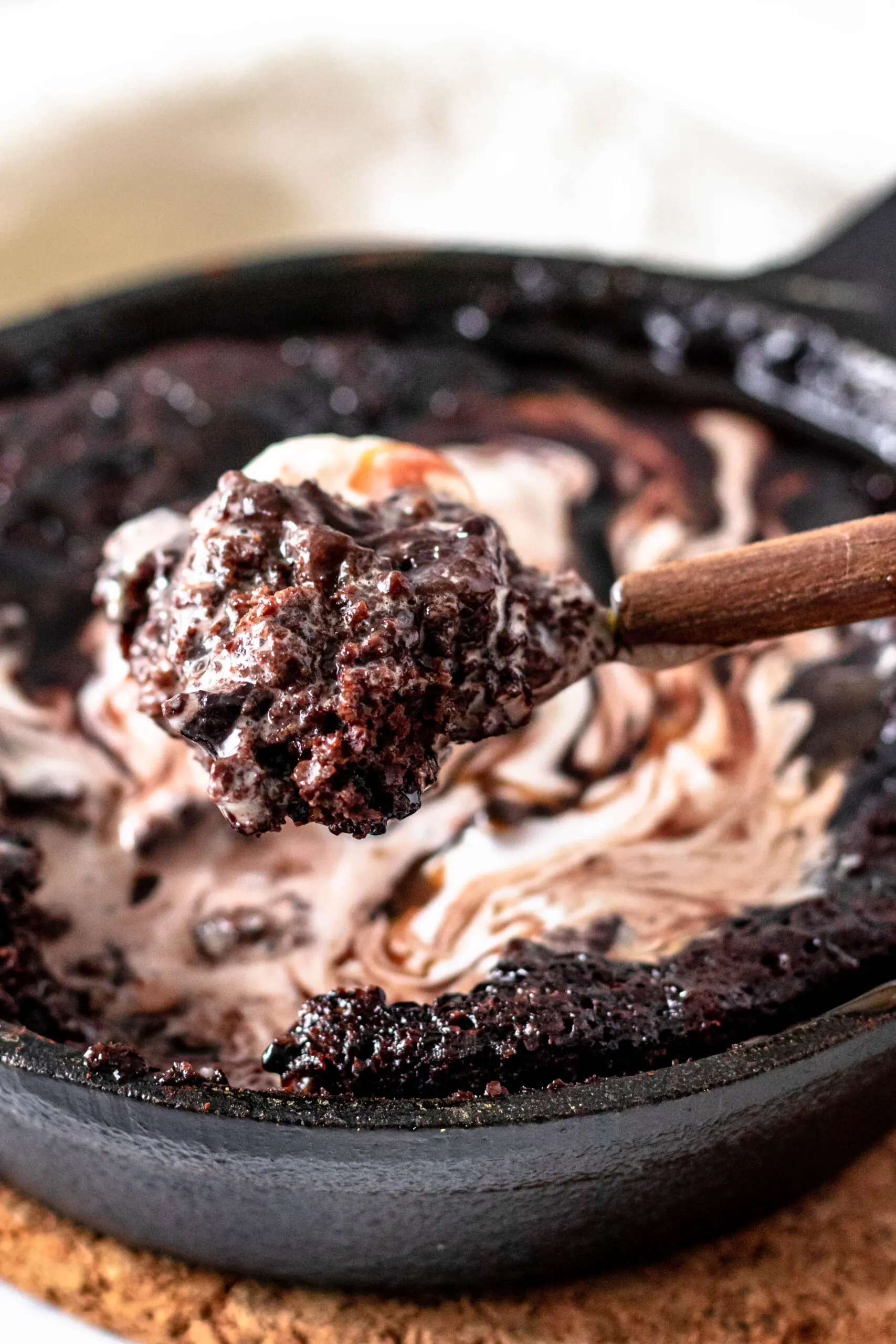 close up of a spoonful of cake to show the ooey gooey texture in all its fudgy deliciousness