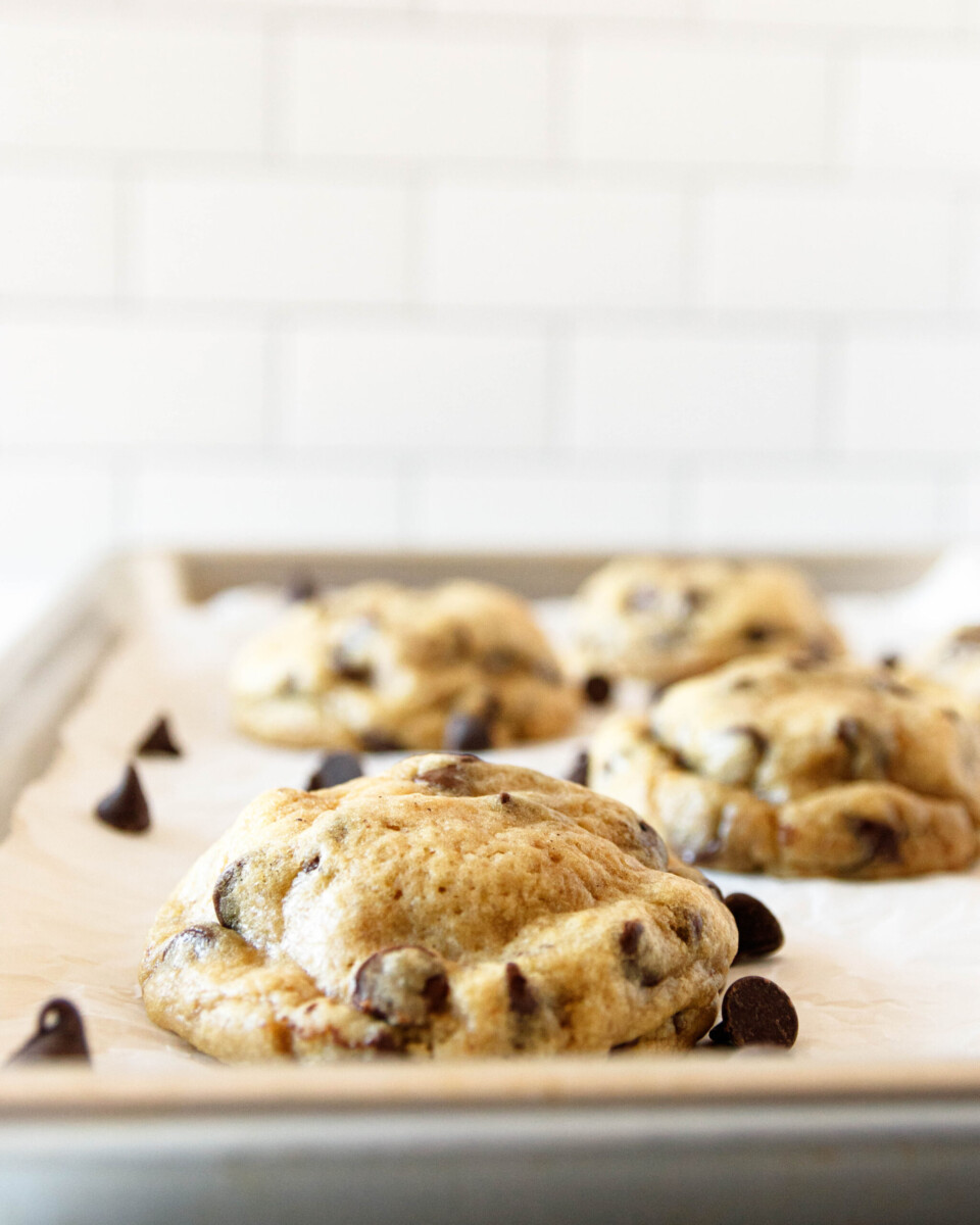 close-up of the just-baked oreo-stuffed chocolate chip cookies on a baking sheet