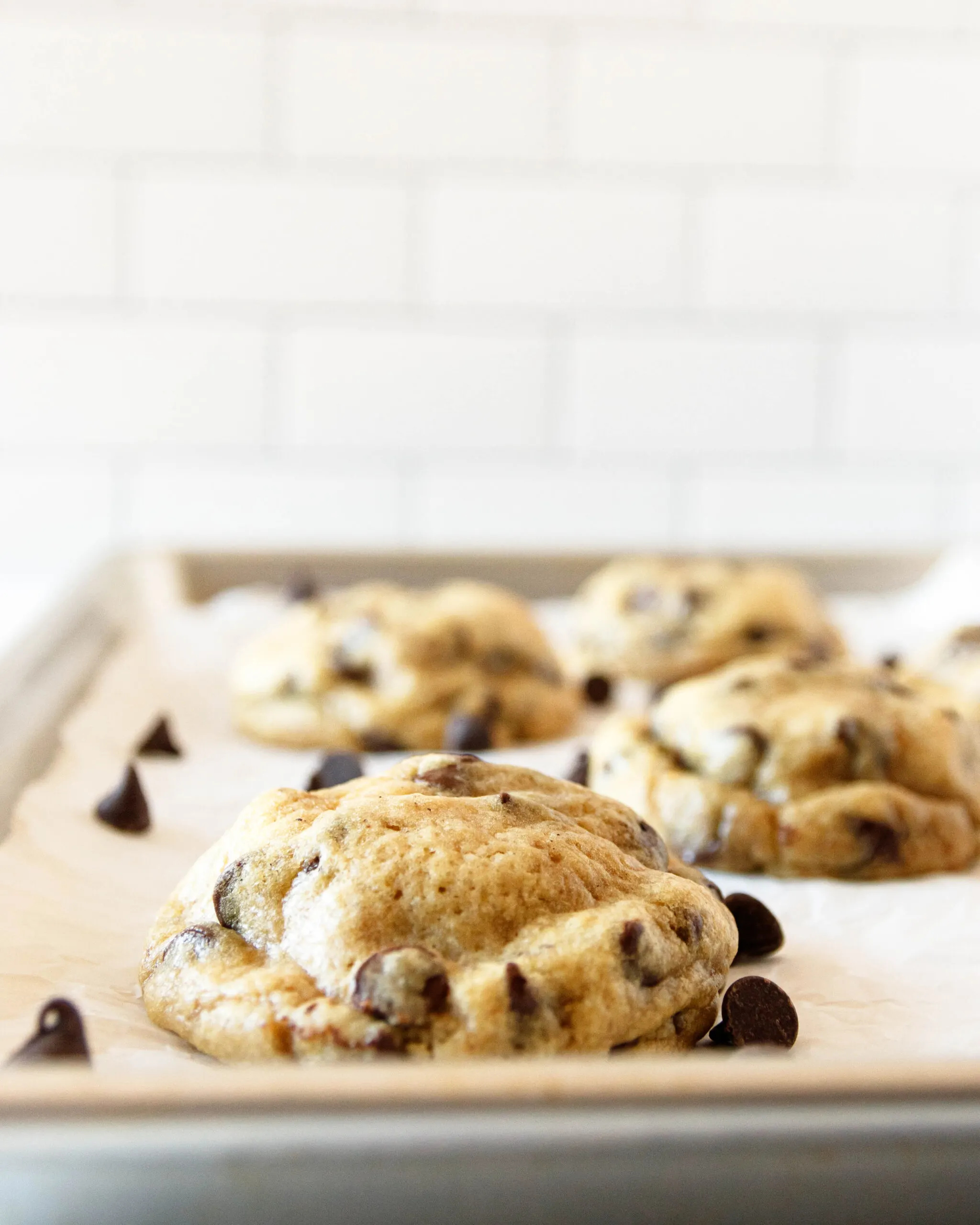 close-up of the just-baked oreo-stuffed chocolate chip cookies on a baking sheet