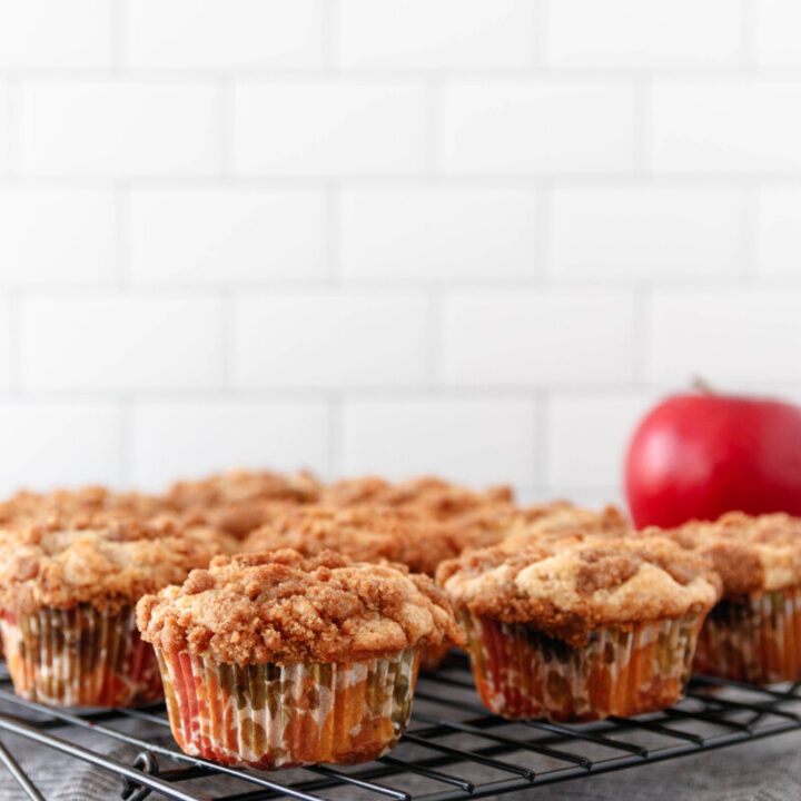 apple coffee cake muffins on a cooling rack