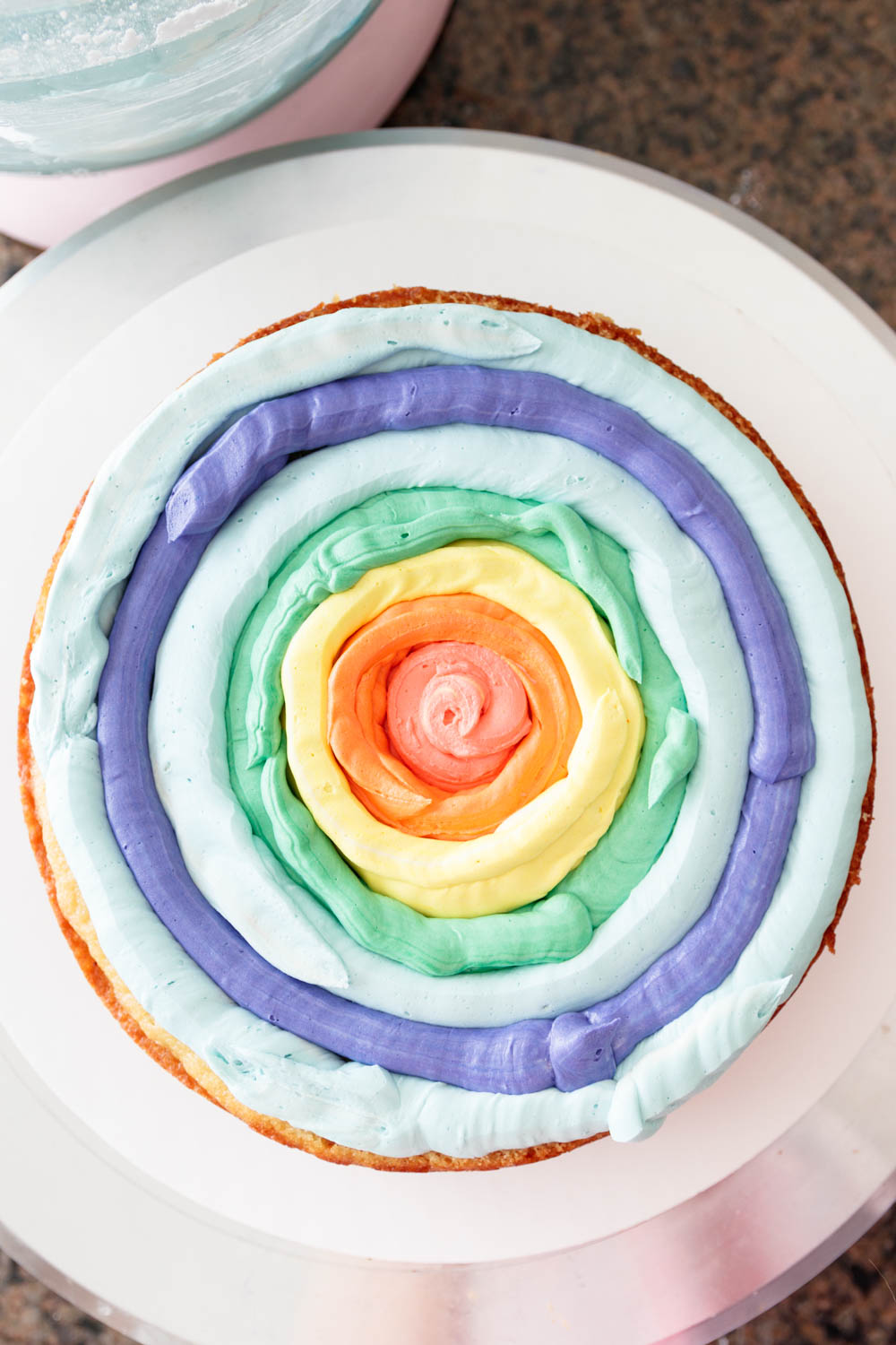 Top-down image showing how the circles should look when you pipe the filling to achieve the rainbow effect once you slice the cake.