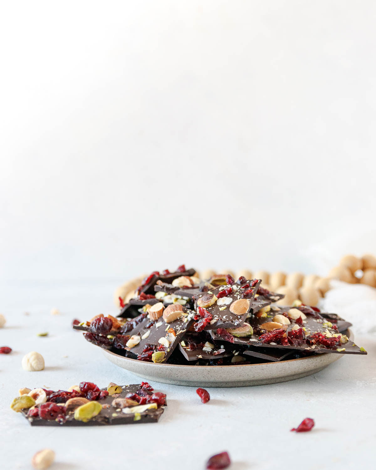 dark chocolate almond bark on a plate, as a casual serving suggestion